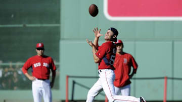 Sep 16, 2016; Boston, MA, USA; Boston Red Sox relief pitcher Joe Kelly (56) catches a football before the start of a game against the New York Yankees at Fenway Park. Mandatory Credit: Bob DeChiara-USA TODAY Sports