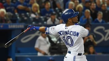 Sep 28, 2016; Toronto, Ontario, CAN; Toronto Blue Jays first baseman Edwin Encarnacion (10) hits a sacrifice RBI against Baltimore Orioles in the first inning at Rogers Centre. Mandatory Credit: Dan Hamilton-USA TODAY Sports