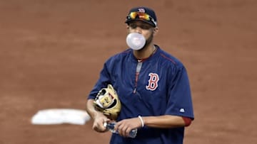 Oct 6, 2016; Cleveland, OH, USA; Boston Red Sox starting pitcher David Price (24) blows a bubble while he fields ground balls before game one of the 2016 ALDS playoff baseball game at Progressive Field. Mandatory Credit: David Richard-USA TODAY Sports