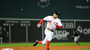 Oct 10, 2016; Boston, MA, USA; Boston Red Sox right fielder Mookie Betts (50) rounds third base to score a run in the eighth inning against the Cleveland Indians during game three of the 2016 ALDS playoff baseball series at Fenway Park. Mandatory Credit: Bob DeChiara-USA TODAY Sports