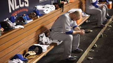Oct 20, 2016; Los Angeles, CA, USA; Chicago Cubs starting pitcher Jon Lester (34) sits in the dugout between inning against the Los Angeles Dodgers in game five of the 2016 NLCS playoff baseball series against the Los Angeles Dodgers at Dodger Stadium. Mandatory Credit: Kelvin Kuo-USA TODAY Sports