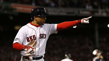 Oct 10, 2016; Boston, MA, USA; Boston Red Sox right fielder Mookie Betts (50) reacts after scoring a run in the eighth inning against the Cleveland Indians during game three of the 2016 ALDS playoff baseball series at Fenway Park. Mandatory Credit: Greg M. Cooper-USA TODAY Sports