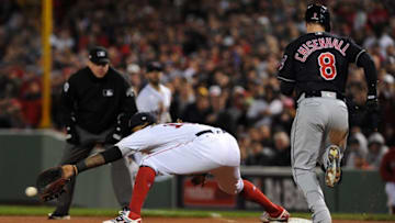 Oct 10, 2016; Boston, MA, USA; Boston Red Sox first baseman Hanley Ramirez (13) scoops the ball for the put out of Cleveland Indians right fielder Lonnie Chisenhall (8) in the eighth inning during game three of the 2016 ALDS playoff baseball series at Fenway Park. Mandatory Credit: Bob DeChiara-USA TODAY Sports