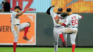 Sep 20, 2016; Baltimore, MD, USA; Boston Red Sox outfielders Chris Young (30), Jackie Bradley, Jr. (25) and Mookie Betts (50) celebrate after beating the Baltimore Orioles 5-2 at Oriole Park at Camden Yards. Mandatory Credit: Evan Habeeb-USA TODAY Sports