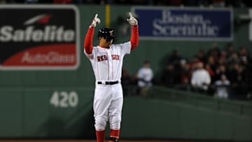 Oct 10, 2016; Boston, MA, USA; Boston Red Sox right fielder Mookie Betts (50) celebrates at second base after doubling in the sixth inning against the Cleveland Indians during game three of the 2016 ALDS playoff baseball series at Fenway Park. Mandatory Credit: Bob DeChiara-USA TODAY Sports
