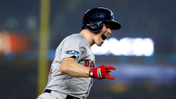 NEW YORK, NEW YORK - OCTOBER 08: Brock Holt #12 of the Boston Red Sox celebrates after hitting a two run home run against Austin Romine #28 of the New York Yankees during the ninth inning in Game Three of the American League Division Series at Yankee Stadium on October 08, 2018 in the Bronx borough of New York City. (Photo by Mike Stobe/Getty Images)