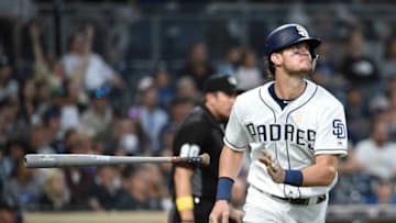 SAN DIEGO, CA - SEPTEMBER 7: Wil Myers #4 of the San Diego Padres flips his bat after hitting a solo home run during the fifth inning of a baseball game against the Colorado Rockies at Petco Park September 7, 2019 in San Diego, California. (Photo by Denis Poroy/Getty Images)