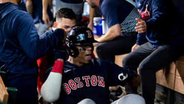HOUSTON, TX - OCTOBER 16: Rafael Devers #11 of the Boston Red Sox is pushed in a laundry cart after hitting a grand slam home run during the second inning of game two of the 2021 American League Championship Series against the Houston Astros at Minute Maid Park on October 16, 2021 in Houston, Texas. (Photo by Billie Weiss/Boston Red Sox/Getty Images)