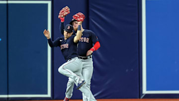 ST. PETERSBURG, FL - APRIL 23: Enrique Hernandez #5 of the Boston Red Sox makes a catch on a fly ball from Ji-Man Choi #26 of the Tampa Bay Rays after almost colliding with Alex Verdugo #99 during the fourth inning in a baseball game at Tropicana Field on April 23, 2022 in St. Petersburg, Florida. (Photo by Mike Carlson/Getty Images)