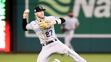 WASHINGTON, DC - SEPTEMBER 17: Trevor Story #27 of the Colorado Rockies throws the ball to first base against the Washington Nationals at Nationals Park on September 17, 2021 in Washington, DC. (Photo by G Fiume/Getty Images)
