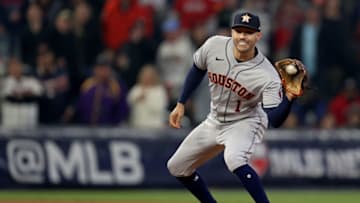 ATLANTA, GEORGIA - OCTOBER 30: Carlos Correa #1 of the Houston Astros turns a double play against the Atlanta Braves during the fourth inning in Game Four of the World Series at Truist Park on October 30, 2021 in Atlanta, Georgia. (Photo by Elsa/Getty Images)