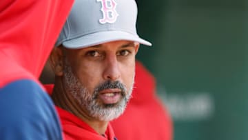 BOSTON, MA - MAY 8: Manager Alex Cora #13 of the Boston Red Sox looks on from the dugout during the third inning against the Chicago White Sox at Fenway Park on May 8, 2022 in Boston, Massachusetts. Teams across the league are wearing pink today in honor of Mother's Day. (Photo By Winslow Townson/Getty Images)