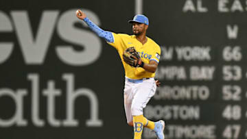 BOSTON, MASSACHUSETTS - JULY 25: Xander Bogaerts #2 of the Boston Red Sox throws to first base for an out in the eighth inning against the Cleveland Guardians at Fenway Park on July 25, 2022 in Boston, Massachusetts. (Photo by Brian Fluharty/Getty Images)