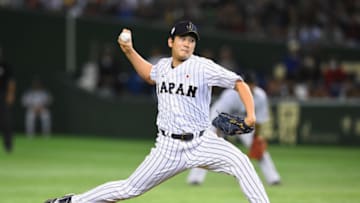 TOKYO, JAPAN - NOVEMBER 21: Tomoyuki Sugano #11 of Japan pitches in the top half of fourth inning during the WBSC Premier 12 third place play off match between Japan and Mexico at the Tokyo Dome on November 21, 2015 in Tokyo, Japan. (Photo by Masterpress/Getty Images)