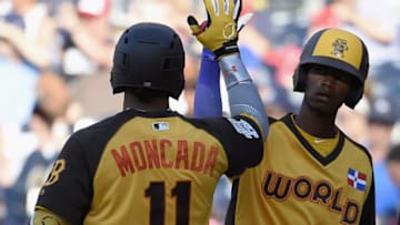 SAN DIEGO, CA - JULY 10: Yoan Moncada #11 of the Boston Red Sox and the World Team is congratulated after hitting a home run during the SiriusXM All-Star Futures Game at PETCO Park on July 10, 2016 in San Diego, California. (Photo by Denis Poroy/Getty Images)
