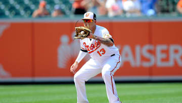 BALTIMORE, MD - JULY 01: Manny Machado #13 of the Baltimore Orioles catches a ball hit by Ian Kinsler #3 (not pictured) of the Los Angeles Angels to end the game in the ninth inning at Oriole Park at Camden Yards on July 1, 2018 in Baltimore, Maryland. (Photo by Greg Fiume/Getty Images)