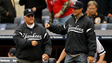 NEW YORK - OCTOBER 20: (L-R) Former New York Yankees Bucky Dent and Aaron Boone walk onto the field to throw out the cermonial first pitch prior to the Yankees playing against the Texas Rangers in Game Five of the ALCS during the 2010 MLB Playoffs at Yankee Stadium on October 20, 2010 in the Bronx borough of New York City. (Photo by Al Bello/Getty Images)