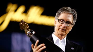 BOSTON, MA - OCTOBER 19: Boston Red Sox owner John Henry celebrates with the trophy after they defeated the Detroit Tigers in Game Six of the American League Championship Series at Fenway Park on October 19, 2013 in Boston, Massachusetts. The Red Sox defeated the Tigers 5-2 to clinch the ALCS in six games. (Photo by Jared Wickerham/Getty Images)