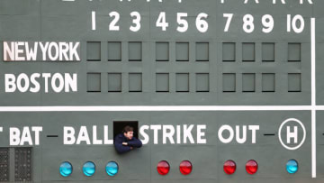 BOSTON, MA - APRIL 11: A scorekeeper looks on from inside the Green Monster before the game between the Boston Red Sox and the New York Yankees at Fenway Park on April 11, 2018 in Boston, Massachusetts. (Photo by Maddie Meyer/Getty Images)