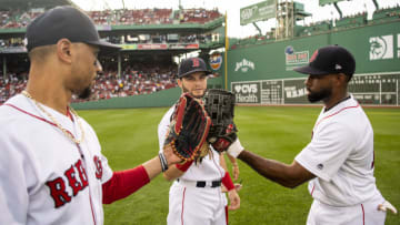 BOSTON, MA - JULY 16: Mookie Betts #50, Jackie Bradley Jr. #19, and Andrew Benintendi #16 of the Boston Red Sox high fives each other before a game against the Toronto Blue Jays on July 16, 2019 at Fenway Park in Boston, Massachusetts. (Photo by Billie Weiss/Boston Red Sox/Getty Images)