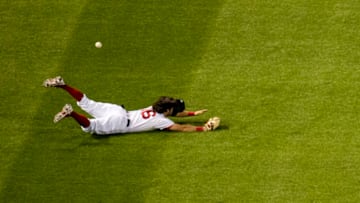 BOSTON, MA - AUGUST 8: Andrew Benintendi #16 of the Boston Red Sox dives as he attempts to catch a fly ball during the fourth inning of a game against the Toronto Blue Jays on August 8, 2020 at Fenway Park in Boston, Massachusetts. (Photo by Billie Weiss/Boston Red Sox/Getty Images)