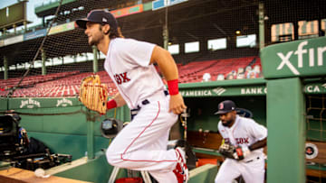 BOSTON, MA - AUGUST 11: Andrew Benintendi #16 of the Boston Red Sox runs onto the field before a game against the Tampa Bay Rays on August 11, 2020 at Fenway Park in Boston, Massachusetts. (Photo by Billie Weiss/Boston Red Sox/Getty Images)