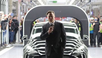 GRUENHEIDE, GERMANY - MARCH 22: Tesla CEO Elon Musk speaks during the official opening of the new Tesla electric car manufacturing plant on March 22, 2022 near Gruenheide, Germany. The new plant, officially called the Gigafactory Berlin-Brandenburg, is producing the Model Y as well as electric car batteries. (Photo by Christian Marquardt - Pool/Getty Images)