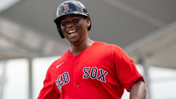 FT. MYERS, FL - MARCH 31: Rafael Devers #11 of the Boston Red Sox reacts after hitting a solo home run during the first inning of a Grapefruit League game against the Minnesota Twins on March 31, 2022 at jetBlue Park at Fenway South in Fort Myers, Florida. (Photo by Billie Weiss/Boston Red Sox/Getty Images)