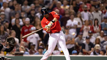 BOSTON, MA - AUGUST 12: J.D. Martinez #28 of the Boston Red Sox hits a game tying RBI single during the ninth inning of a game against the New York Yankees on August 12, 2022 at Fenway Park in Boston, Massachusetts.(Photo by Billie Weiss/Boston Red Sox/Getty Images)