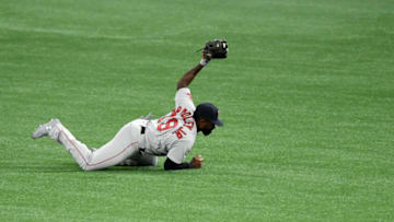ST PETERSBURG, FLORIDA - AUGUST 04: Jackie Bradley Jr. #19 of the Boston Red Sox makes a diving catch on a hit from Brandon Lowe #8 of the Tampa Bay Rays (not pictured) to end the third inning at Tropicana Field on August 04, 2020 in St Petersburg, Florida. (Photo by Douglas P. DeFelice/Getty Images)