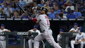 KANSAS CITY, MISSOURI - JUNE 18: Rafael Devers #11 of the Boston Red Sox hits a home run in the eighth inning against the Kansas City Royals at Kauffman Stadium on June 18, 2021 in Kansas City, Missouri. (Photo by Ed Zurga/Getty Images)