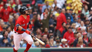 BOSTON, MASSACHUSETTS - OCTOBER 10: Kyle Schwarber #18 of the Boston Red Sox hits a solo homerun in the first inning against the Tampa Bay Rays during Game 3 of the American League Division Series at Fenway Park on October 10, 2021 in Boston, Massachusetts. (Photo by Maddie Meyer/Getty Images)
