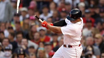 BOSTON, MASSACHUSETTS - OCTOBER 20: Rafael Devers #11 of the Boston Red Sox breaks his bat on a ground out against the Houston Astros in the second inning of Game Five of the American League Championship Series at Fenway Park on October 20, 2021 in Boston, Massachusetts. (Photo by Maddie Meyer/Getty Images)