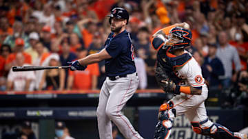 HOUSTON, TX - OCTOBER 22: Travis Shaw #23 of the Boston Red Sox strikes out as Martin Maldonado #15 of the Houston Astros throws out a runner at second base during the seventh inning of game six of the 2021 American League Championship Series at Minute Maid Park on October 22, 2021 in Houston, Texas. (Photo by Billie Weiss/Boston Red Sox/Getty Images)