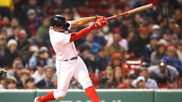 BOSTON, MA - MAY 04: Xander Bogaerts #2 of the Boston Red Sox hits a solo home run in the eighth inning of a game against the Los Angeles Angels Fenway Park on May 4, 2022 in Boston, Massachusetts. (Photo by Adam Glanzman/Getty Images)