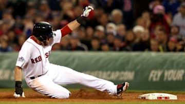 BOSTON, MA - OCTOBER 30: Jacoby Ellsbury #2 of the Boston Red Sox slides into first base after a rundown against the St. Louis Cardinals during Game Six of the 2013 World Series at Fenway Park on October 30, 2013 in Boston, Massachusetts. (Photo by Rob Carr/Getty Images)