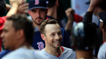 KANSAS CITY, MO - SEPTEMBER 14: Daniel Nava #29 of the Boston Red Sox is congratulated by teammates in the dugout after hitting a grand slam home run during the 6th inning of the game against the Kansas City Royals at Kauffman Stadium on September 14, 2014 in Kansas City, Missouri. (Photo by Jamie Squire/Getty Images)