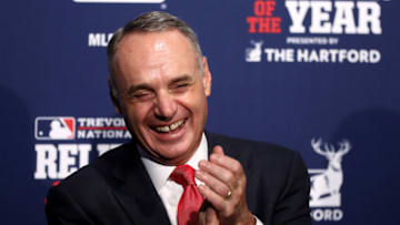 CHICAGO, IL - OCTOBER 29: MLB Commissioner Rob Manfred laughs during a ceremony naming the 2016 winners of the Mariano Rivera American League Reliever of the Year Award and the Trevor Hoffman National League Reliever of the Year Award before Game Four of the 2016 World Series between the Chicago Cubs and the Cleveland Indians at Wrigley Field on October 29, 2016 in Chicago, Illinois. (Photo by Elsa/Getty Images)