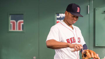 BOSTON, MA - SEPTEMBER 5: Rafael Devers #11 of the Boston Red Sox sprays his glove before a game against the Toronto Blue Jays on September 5, 2017 at Fenway Park in Boston, Massachusetts. (Photo by Billie Weiss/Boston Red Sox/Getty Images)