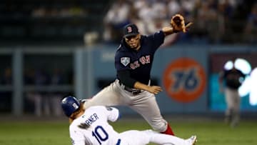 LOS ANGELES, CA - OCTOBER 26: Justin Turner #10 of the Los Angeles Dodgers slides into Xander Bogaerts #2 of the Boston Red Sox as he attempts to turn the double-play during the eighth inning in Game Three of the 2018 World Series at Dodger Stadium on October 26, 2018 in Los Angeles, California. (Photo by Ezra Shaw/Getty Images)