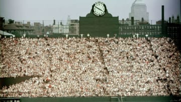 General view of Boston's Fenway Park, home of the American League baseball team the Boston Red Sox shows the fans packed in the bleachers in the outfield by the Gruen clock, 1960s. Beyond the stadium walls we can see the John Hancock Building at right. (Photo by Hulton Archive/Getty Images)