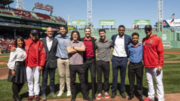 BOSTON, MA - SEPTEMBER 19: Senior Vice President of Major League & Minor League Operations Raquel Ferreira, manager Alex Cora, and Vice President of Player Development of the Boston Red Sox Ben Crockett, and rookies Tristan Casas, Ryan Fitzgerald, Thad Ward, Jarren Duran, Darel Belen, Nixson Munoz, and Trevor Kelley pose for a group photo after being introduced as the 2019 Minor League Awards winners before a game against the San Francisco Giants on September 19, 2019 at Fenway Park in Boston, Massachusetts. (Photo by Billie Weiss/Boston Red Sox/Getty Images)