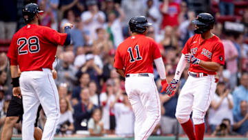 BOSTON, MA - MAY 27: Xander Bogaerts #2 of the Boston Red Sox reacts with Rafael Devers #11 after hitting a three-run home run during the first inning of a game against the Baltimore Orioles on May 27, 2022 at Fenway Park in Boston, Massachusetts. (Photo by Maddie Malhotra/Boston Red Sox/Getty Images)