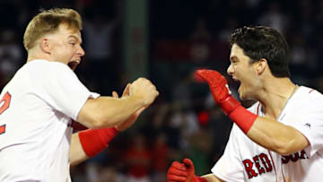 BOSTON, MA - AUGUST 06: Andrew Benintendi #16 reacts with Brock Holt #12 of the Boston Red Sox after hitting the game-winning walk-off single to defeat the New York Yankees in the tenth inning at Fenway Park on August 6, 2018 in Boston, Massachusetts. (Photo by Adam Glanzman/Getty Images)