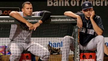 BALTIMORE, MD - SEPTEMBER 11: Alex Rodriguez #13 (L) and Derek Jeter #2 of the New York Yankees look on against the Baltimore Orioles in the ninth inning at Oriole Park at Camden Yards on September 11, 2013 in Baltimore, Maryland.(Photo by Patrick Smith/Getty Images)
