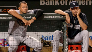 BALTIMORE, MD - SEPTEMBER 11: Alex Rodriguez #13 (L) and Derek Jeter #2 of the New York Yankees look on against the Baltimore Orioles in the ninth inning at Oriole Park at Camden Yards on September 11, 2013 in Baltimore, Maryland.(Photo by Patrick Smith/Getty Images)