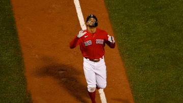 BOSTON, MA - OCTOBER 4: Xander Bogaerts #2 of the Boston Red Sox looks up as he nears home plate after his grand slam home run during the fifth inning against the Tampa Bay Rays at Fenway Park on October 4, 2022 in Boston, Massachusetts. (Photo By Winslow Townson/Getty Images)