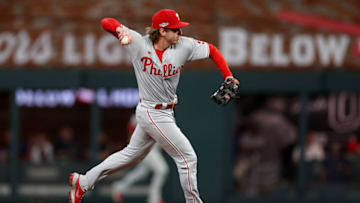 ATLANTA, GEORGIA - OCTOBER 12: Bryson Stott #5 of the Philadelphia Phillies throws to first base against the Atlanta Braves during the second inning in game two of the National League Division Series at Truist Park on October 12, 2022 in Atlanta, Georgia. (Photo by Patrick Smith/Getty Images)
