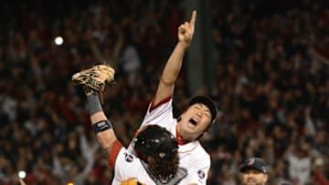 BOSTON, MA - OCTOBER 19: Koji Uehara #19 of the Boston Red Sox reacts and jumps into the arms of Jarrod Saltalamacchia #39 after defeating the Detroit Tigers in Game Six of the American League Championship Series at Fenway Park on October 19, 2013 in Boston, Massachusetts. The Red Sox defeated the Tigers 5-2 to clinch the ALCS in six games. (Photo by Mark Cunningham/MLB Photos via Getty Images)