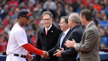 BOSTON, MA - APRIL 4: Xander Bogaerts #2 of the Boston receives a championship ring from Principal Owner John W. Henry and Chairman Tom Werner during a ceremony honoring the 2013 World Series Champion Boston Red Sox before the start of a game against the Milwaukee Brewers at Fenway Park on April 4, 3014 in Boston, Massachusetts. (Photo by Michael Ivins/Boston Red Sox/Getty Images)